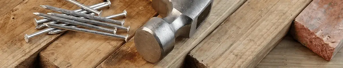 Hammer and nails on hardwood flooring boards in Detroit, MI