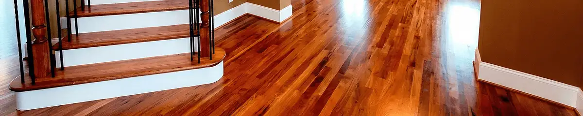 Base floor of a staircase with professionally restored wood flooring in Detroit MI