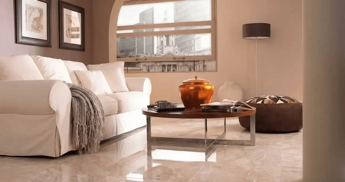 Modern living room with professionally installed marble flooring, a beige sofa, coffee table in Detroit, MI