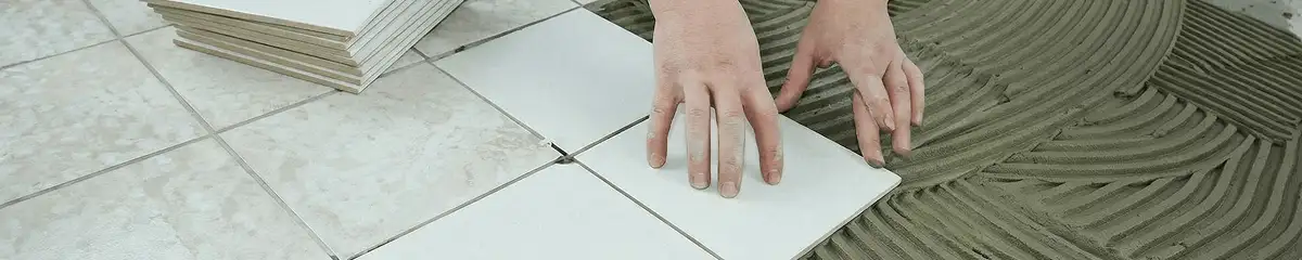 Professional installing white tile floors in Detroit, MI
