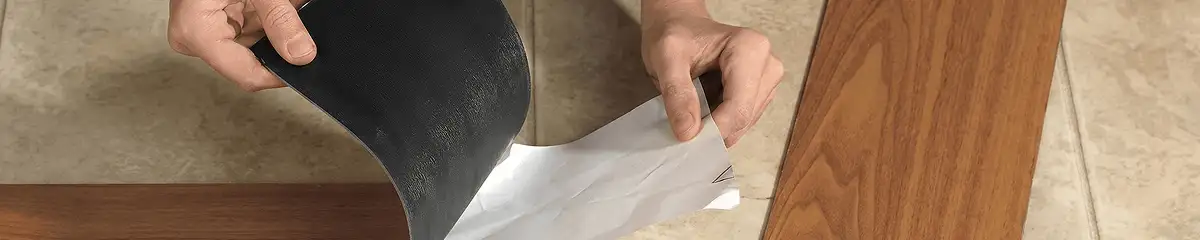 A professional installing vinyl flooring in Detroit, MI